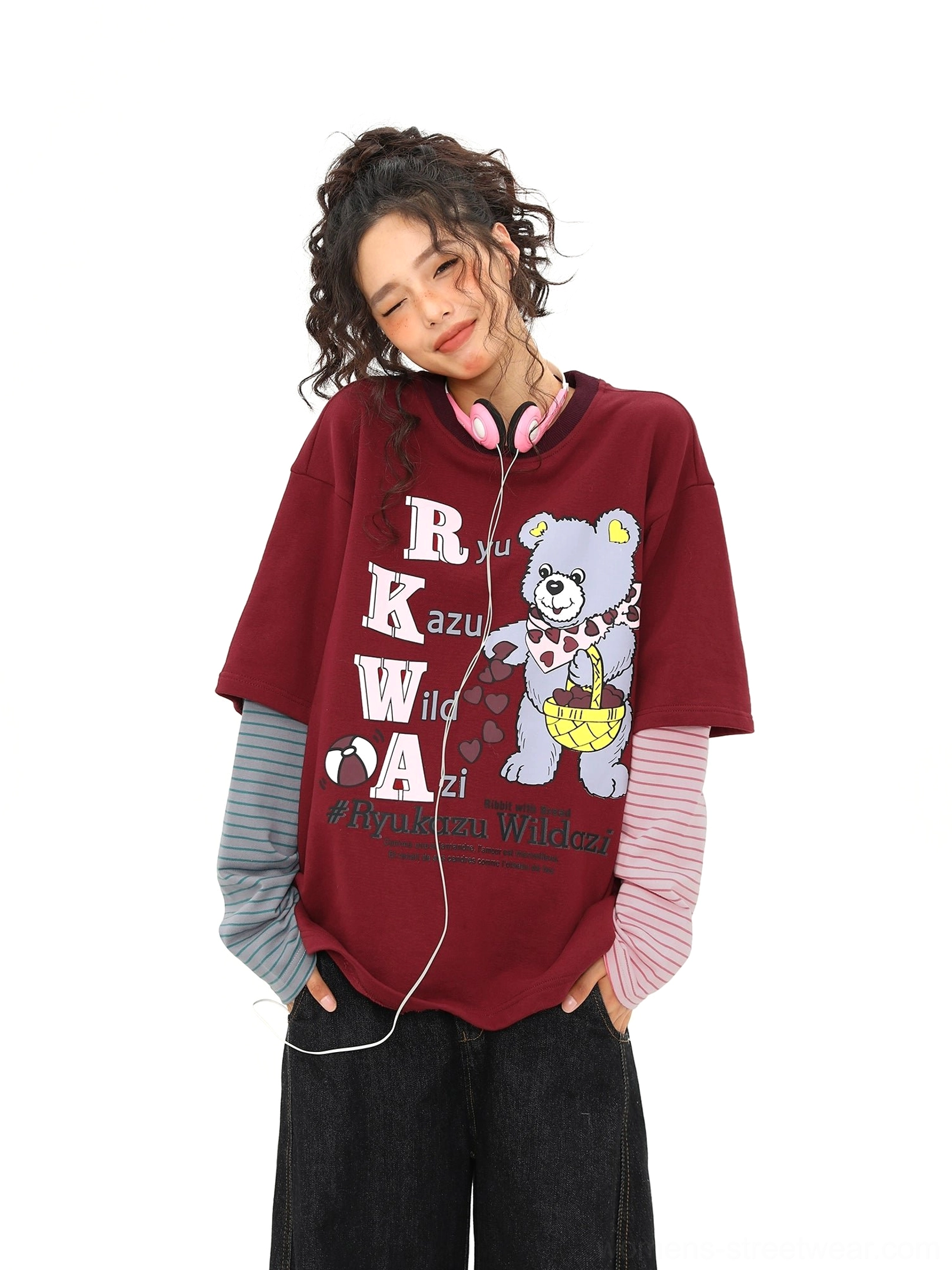 Front styling view of an oversized burgundy bear graphic layered T-shirt with mismatched pink and grey sleeves