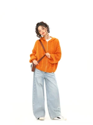Orange cable knit zip-up hoodie styled with wide-leg jeans and crossbody bag in Korean streetwear outfit