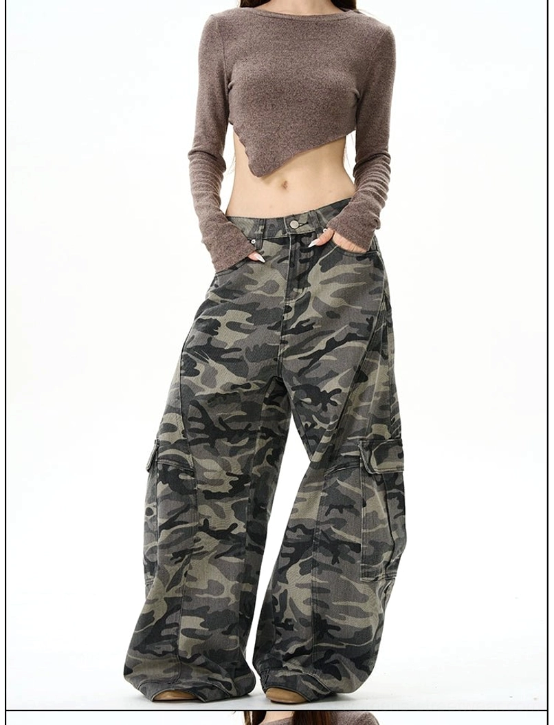 Three-quarter front view of oversized camo cargo pants with front pockets, side utility pockets, and a wide-leg streetwear fit