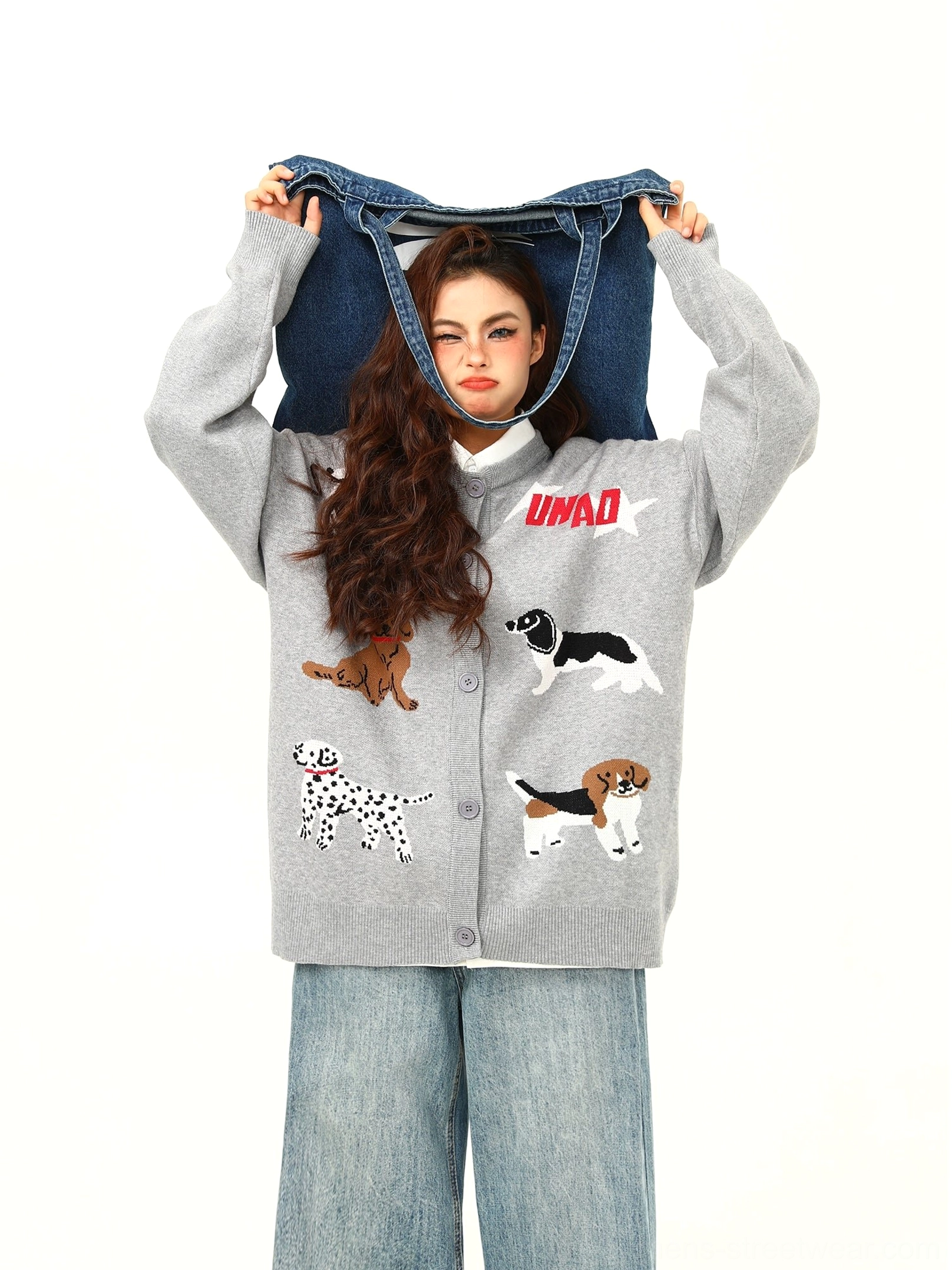 Gray oversized cartoon puppy knit cardigan with red letter graphics shown from the front with wide-leg jeans