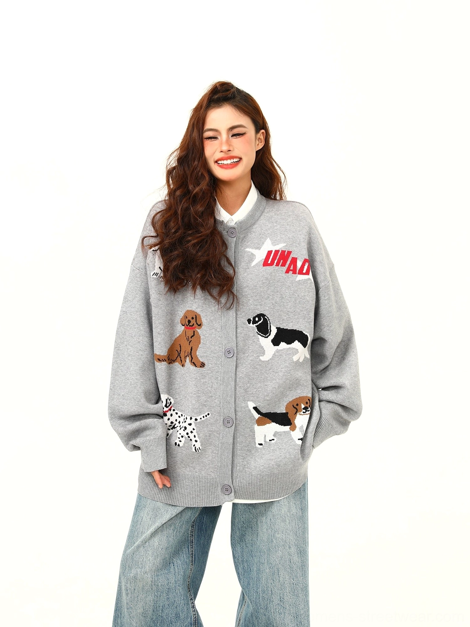 Three-quarter front view of gray cartoon dog graphic knit cardigan in a relaxed oversized streetwear fit