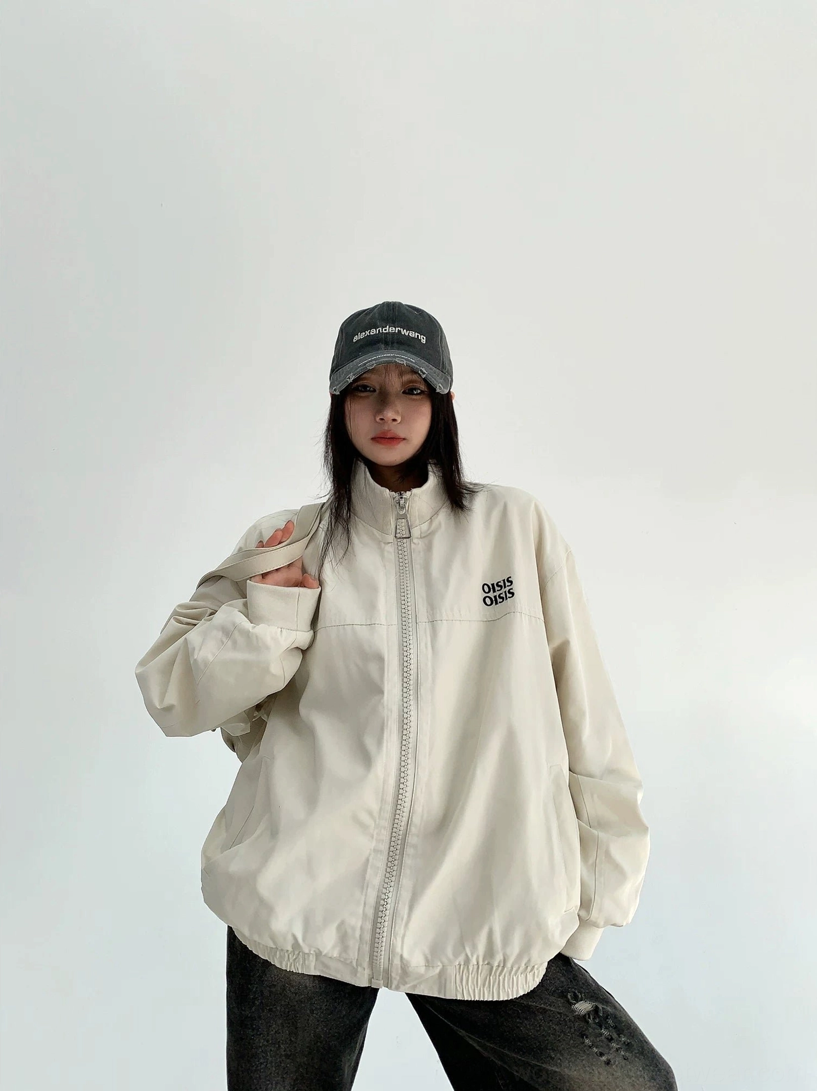 Off-white oversized cloud shell windbreaker jacket for women showing elasticated hem, cuffs, stand collar and relaxed streetwear silhouette