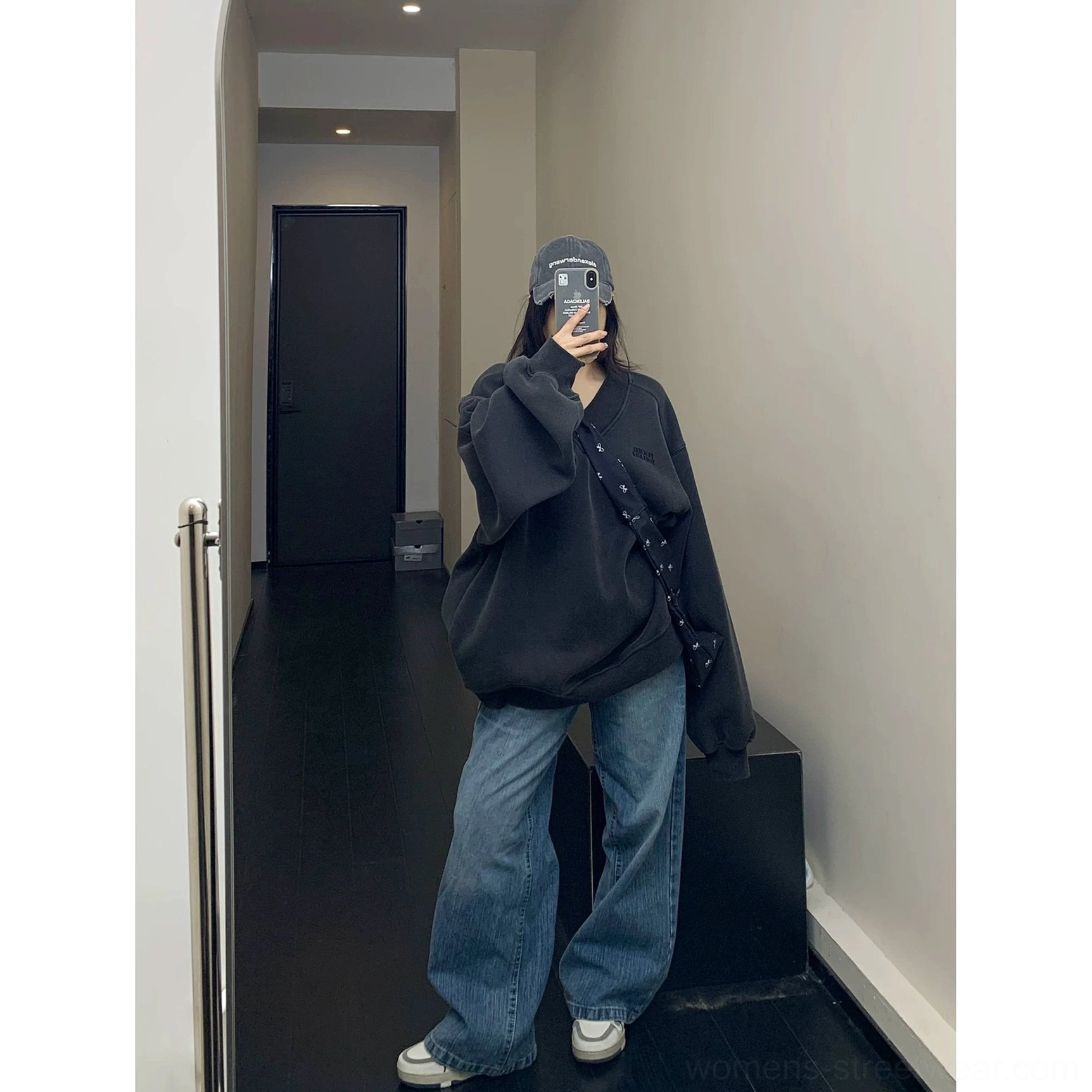 Oversized collegiate crest V-neck fleece sweatshirt relaxed dropped shoulder silhouette