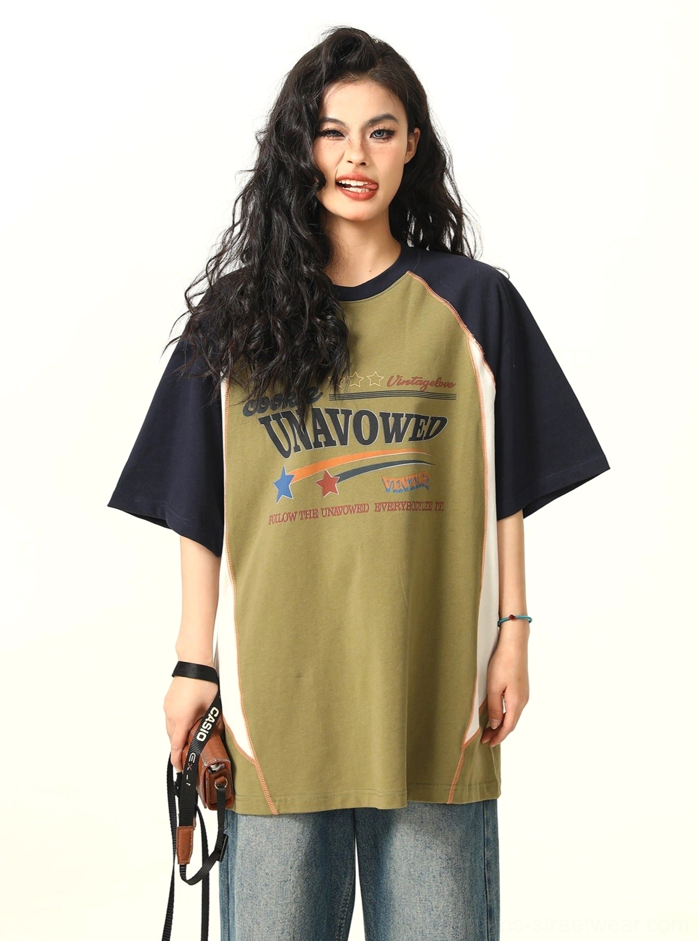 Olive green oversized raglan graphic T-shirt with navy contrast sleeves and collegiate chest print