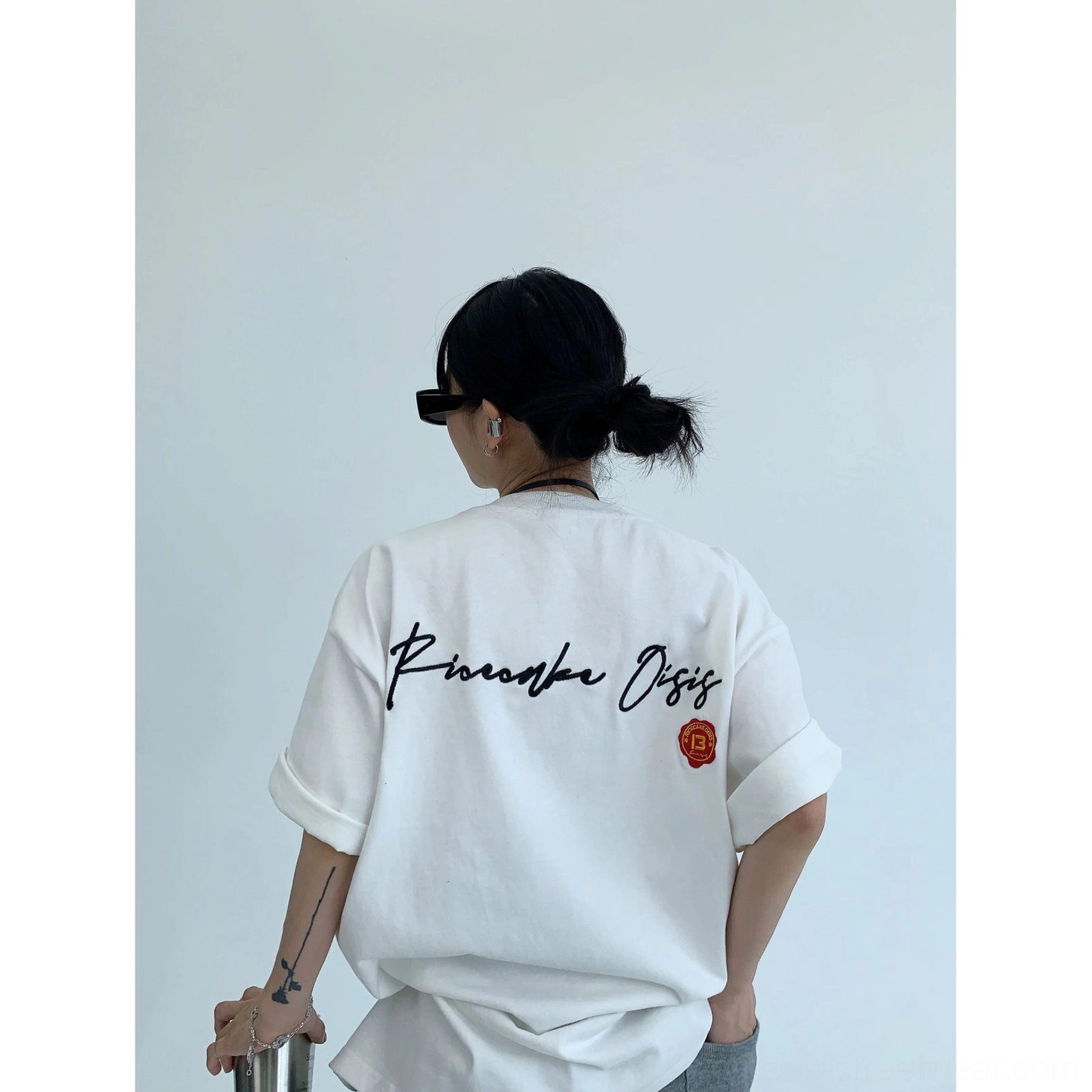 Oversized cotton streetwear T-shirt with expressive neon script back graphic, relaxed sleeves, and versatile urban styling