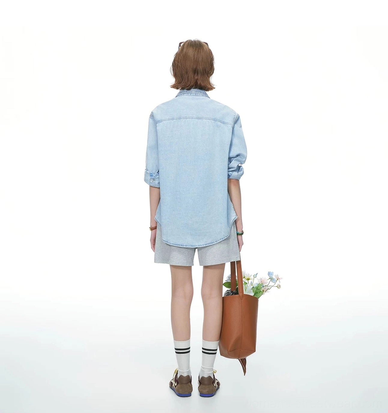 Oversized denim button-up shirt suitable for spring summer layering with tees, cargo pants, wide-leg trousers, and shorts