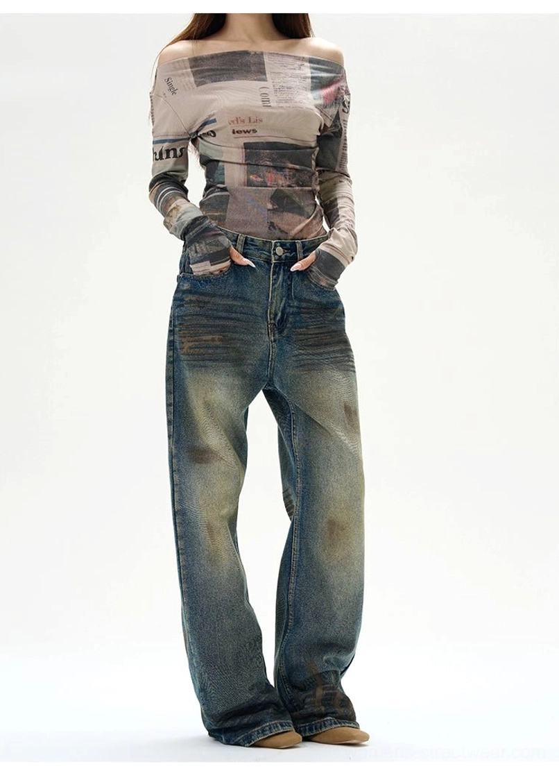Oversized distressed blue denim jeans with wide legs, worn-in finish, and versatile unisex streetwear styling