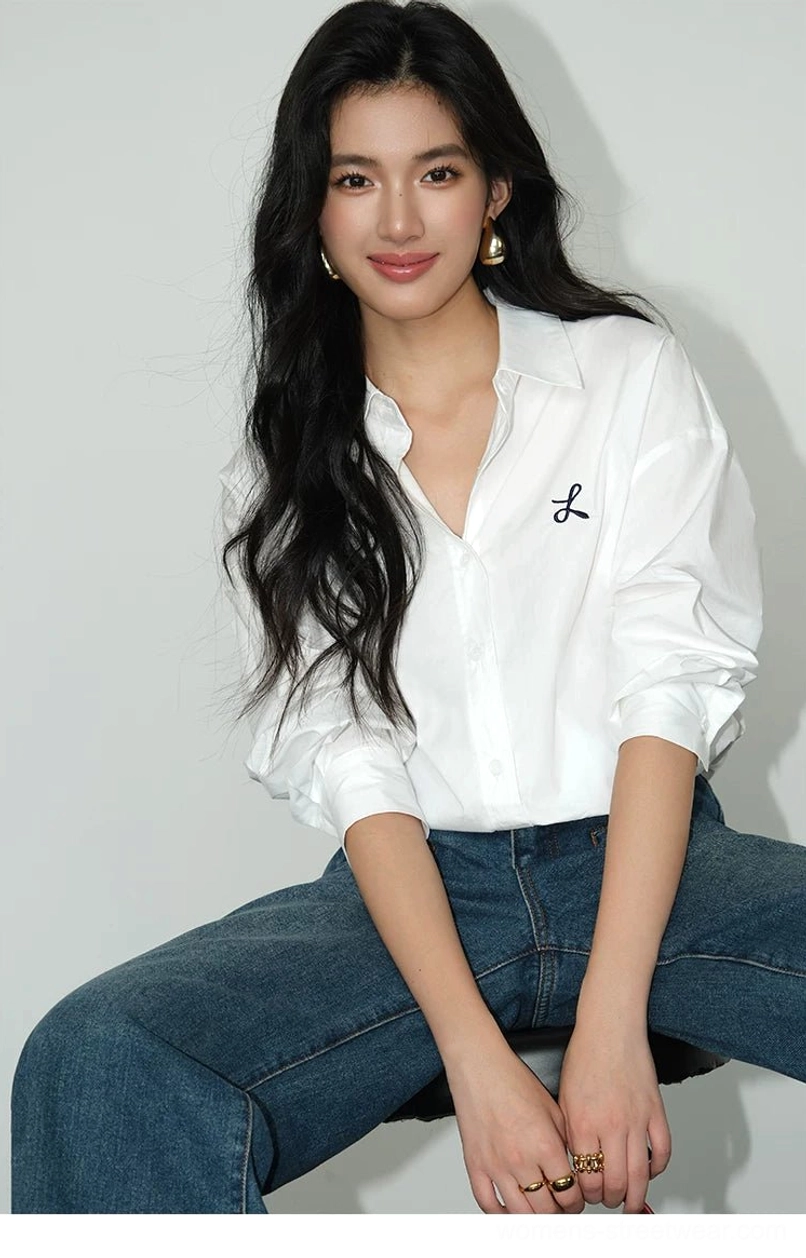 White oversized longline button-down shirt with black embroidered bow detail front view