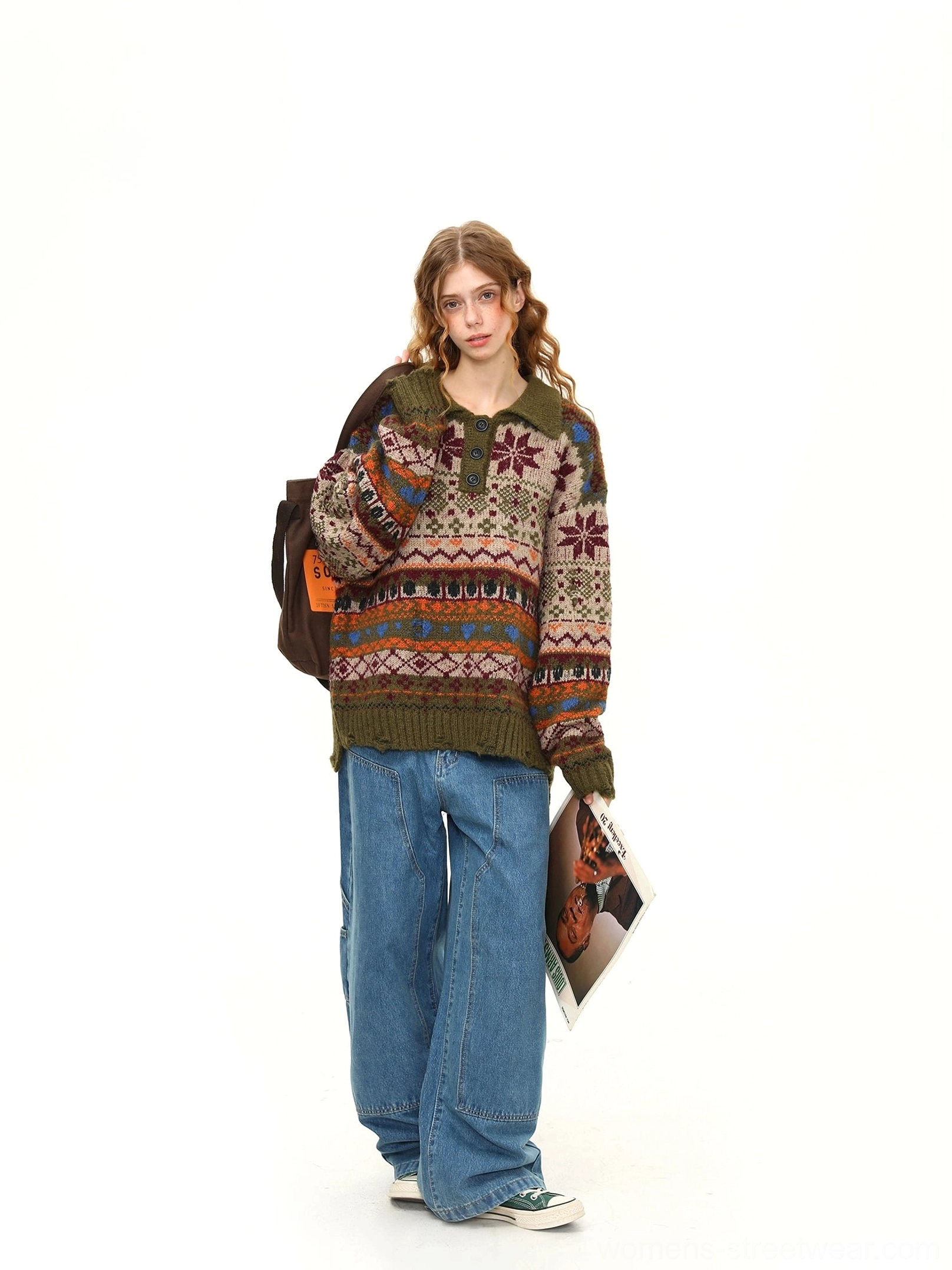 Side full-body view of an oversized Fair Isle knit polo sweater featuring a relaxed silhouette, half-button neckline, and retro winter pattern