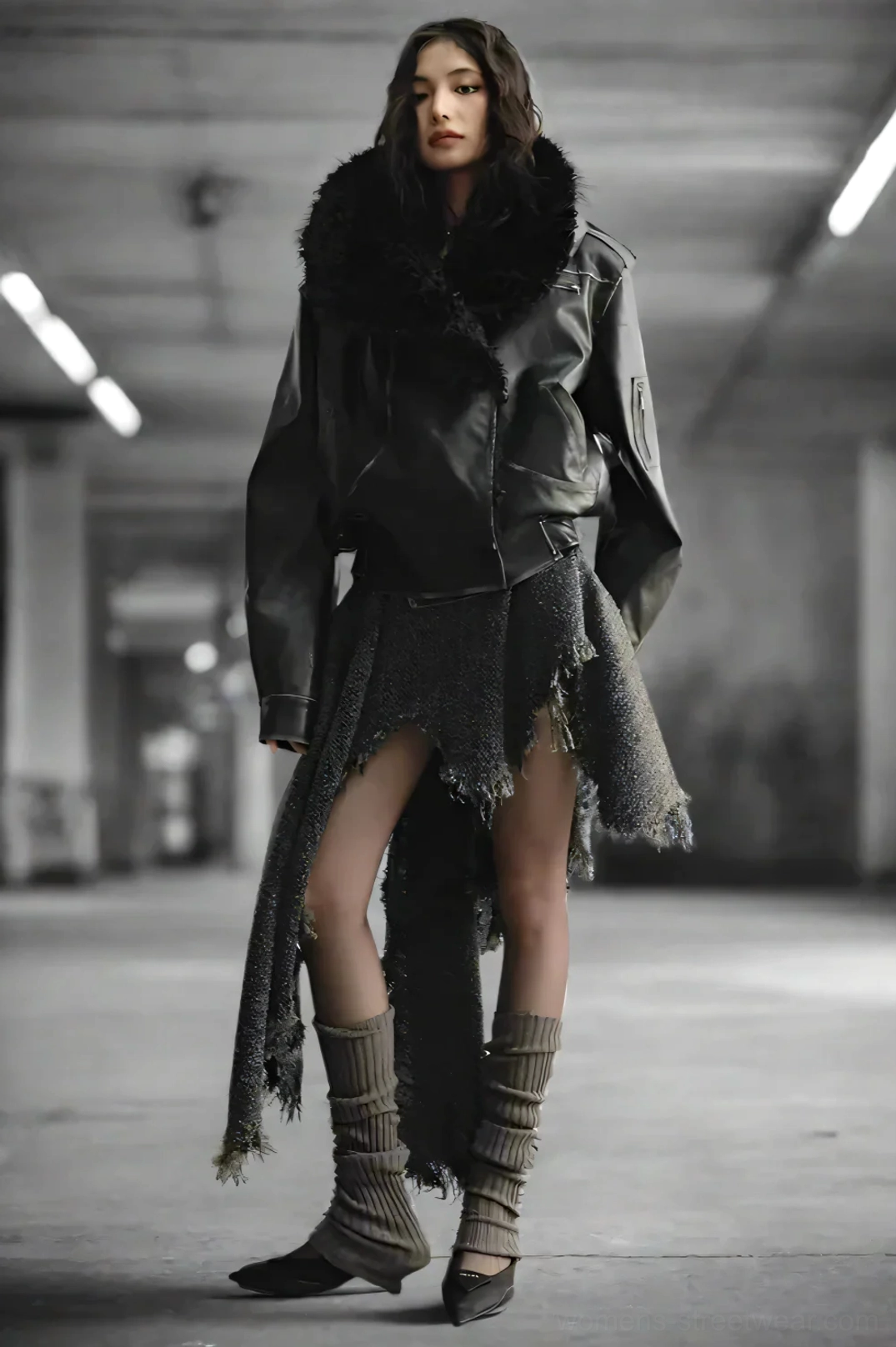 Full body view of a woman styling an oversized faux fur aviator jacket with leg warmers and pointed shoes