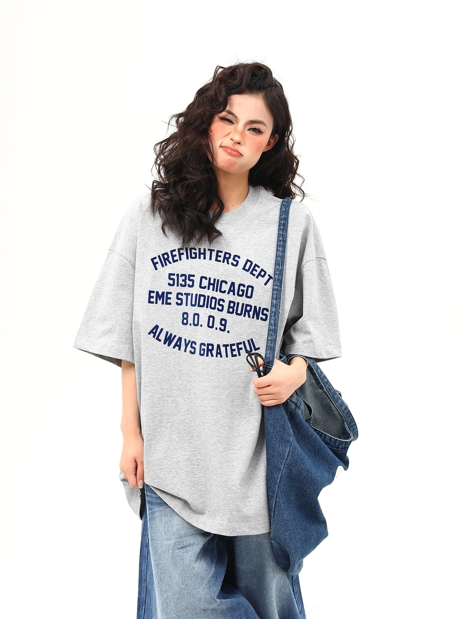 Full front view of oversized gray Chicago firefighter inspired lettering tee in casual women’s streetwear outfit