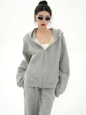 Heather gray oversized zip-up hoodie jacket for women styled with sunglasses in a minimalist Korean streetwear outfit