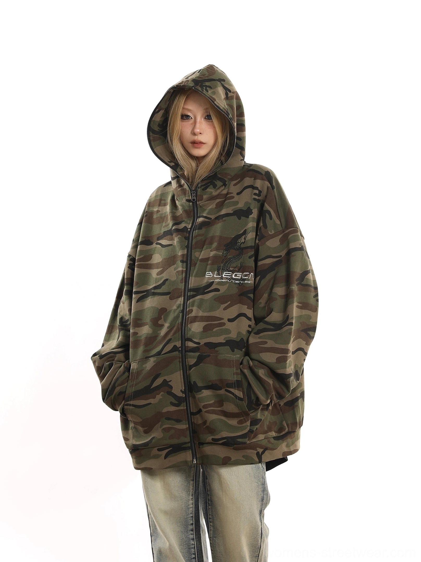Oversized green camouflage zip-up fleece jacket with attached hood, front pockets, and relaxed Korean streetwear styling