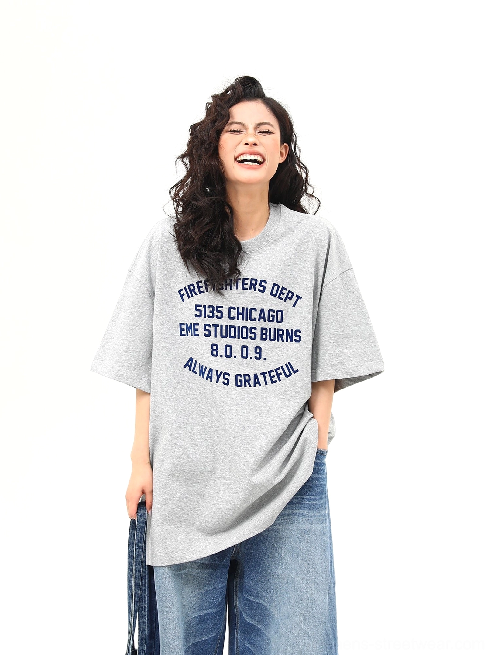 Front chest graphic detail of oversized heather gray Chicago lettering short sleeve streetwear tee for women