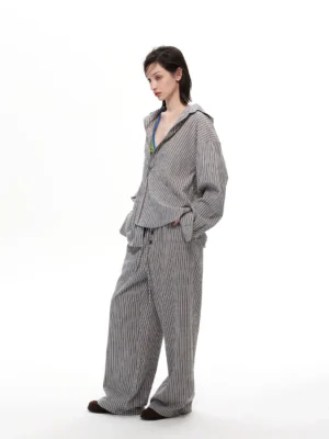 Light gray pinstripe hooded lounge shirt and wide-leg trousers in an oversized Korean streetwear outfit front view