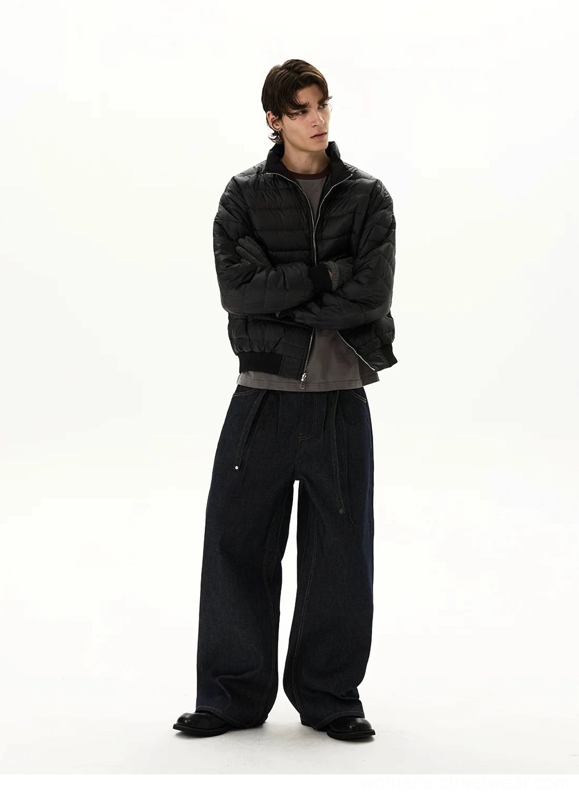 Front styling view of oversized dark blue balloon-leg denim jeans with clean front pockets, relaxed fit, and exaggerated streetwear proportions