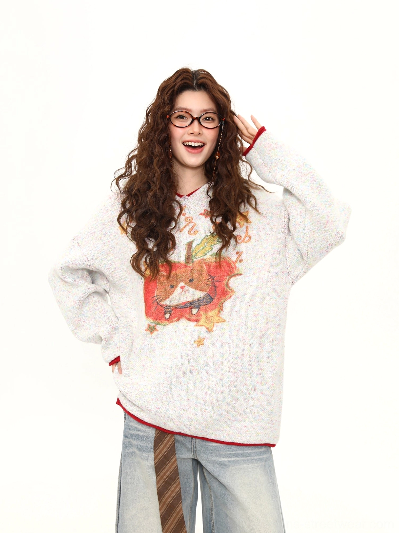 Full front view of oversized kitty apple pie sweater showing dropped shoulders, loose fit, and red contrast trim