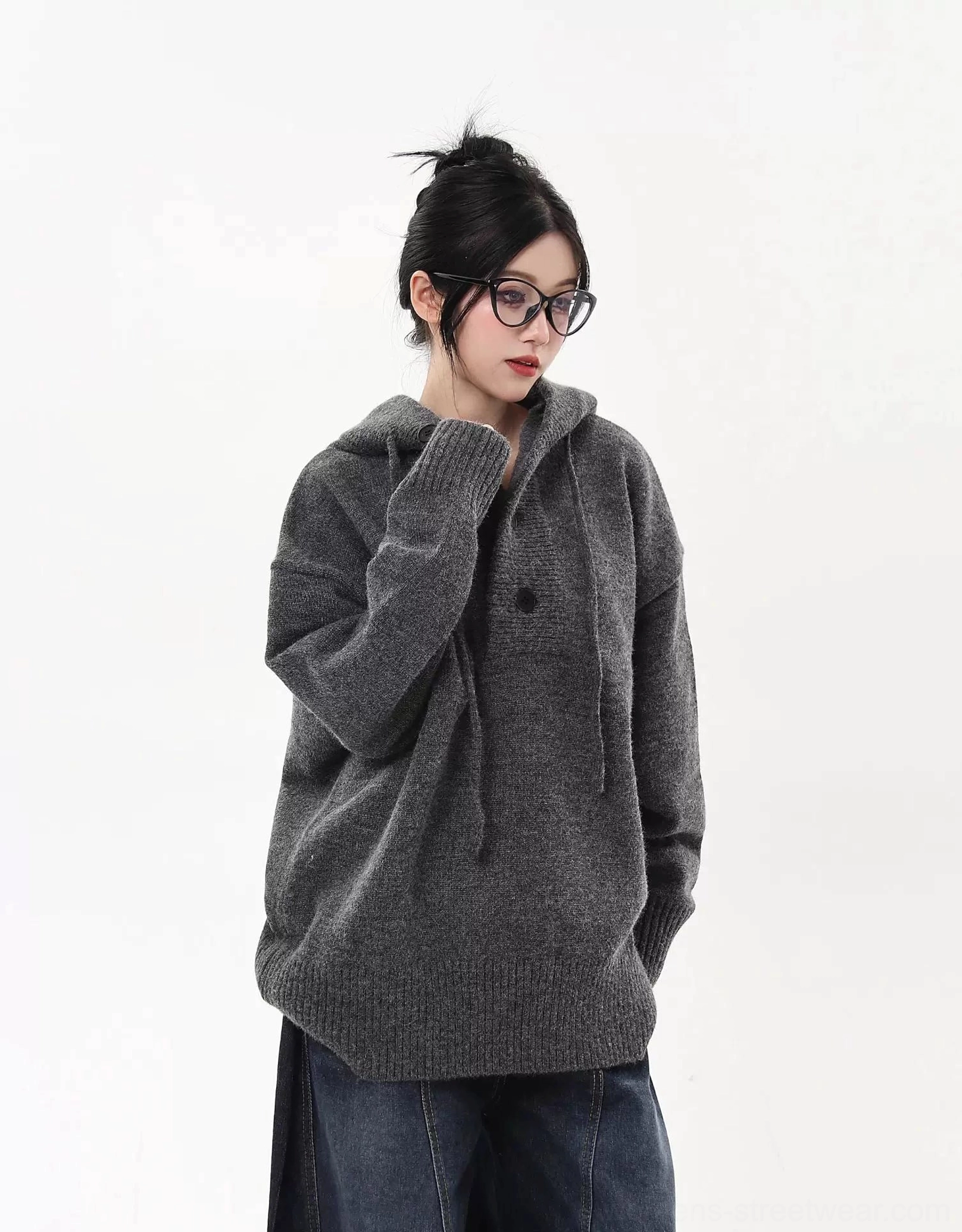 Oversized knit half-button streetwear hoodie sweater product view showing the relaxed drop-shoulder silhouette and ribbed hem