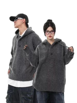 Heather gray oversized knit half-button streetwear hoodie sweater worn by two models in a side full-body streetwear outfit view