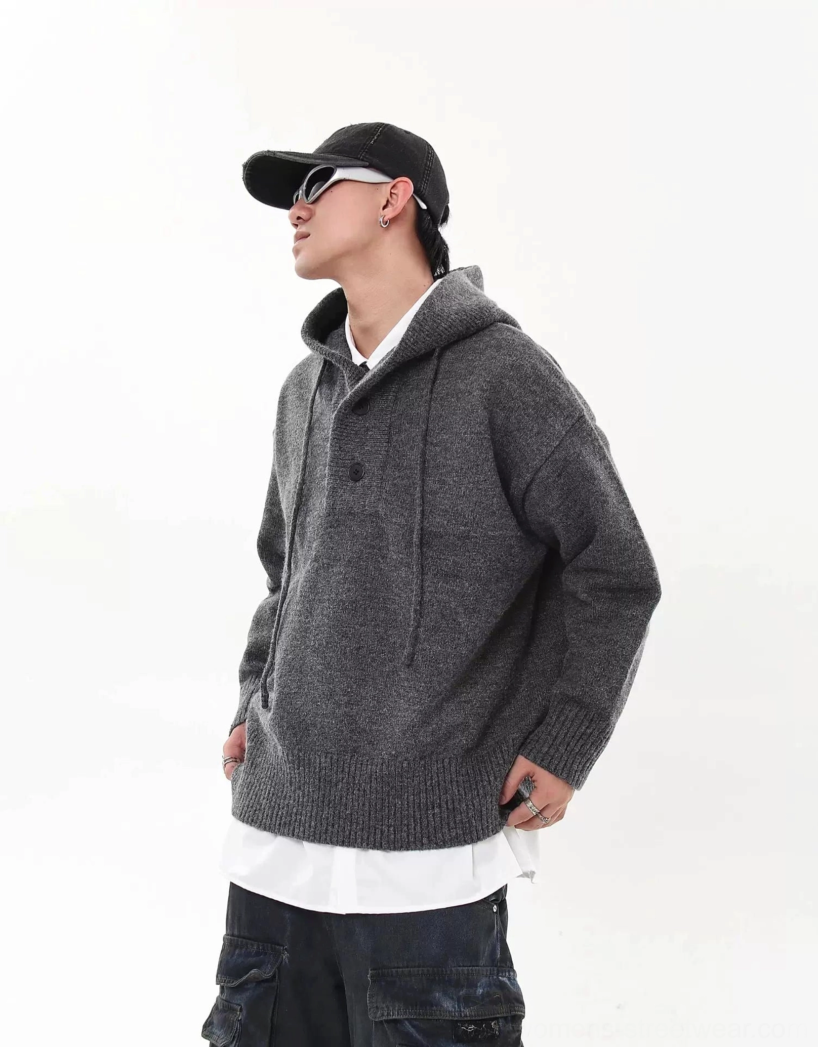 Heather gray oversized knit streetwear hoodie sweater rear side view showing the hood, drop shoulders, and ribbed cuffs