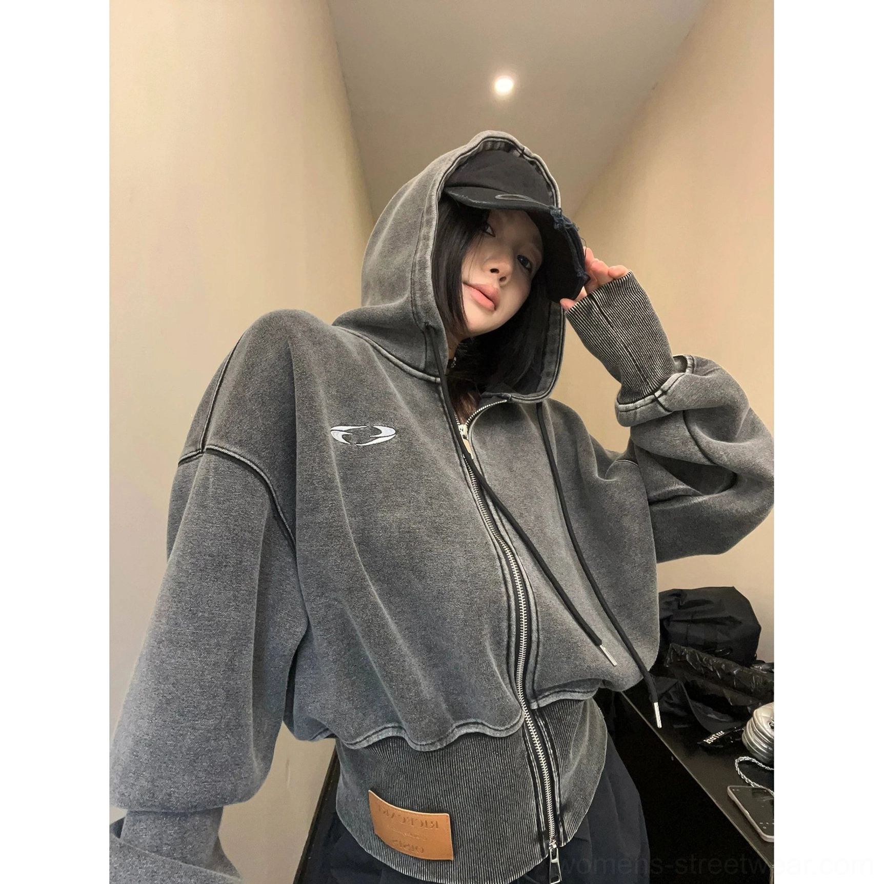 Oversized Korean streetwear hoodie with a cropped balloon silhouette, soft cotton fleece texture, attached hood, and full front zipper