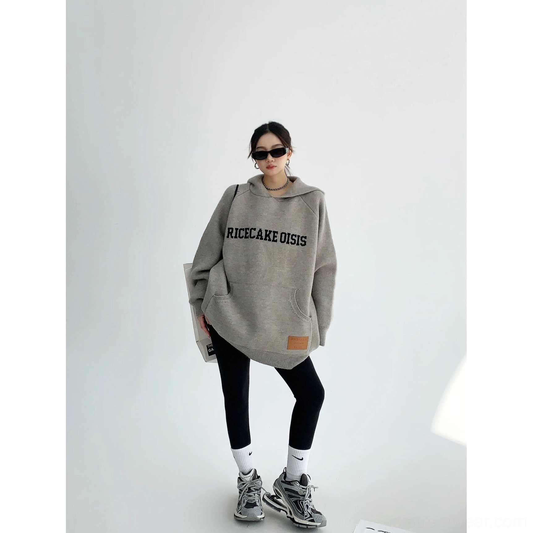Oversized Korean streetwear knit hoodie with collegiate-inspired lettering, kangaroo pocket, extended sleeves, and casual fit