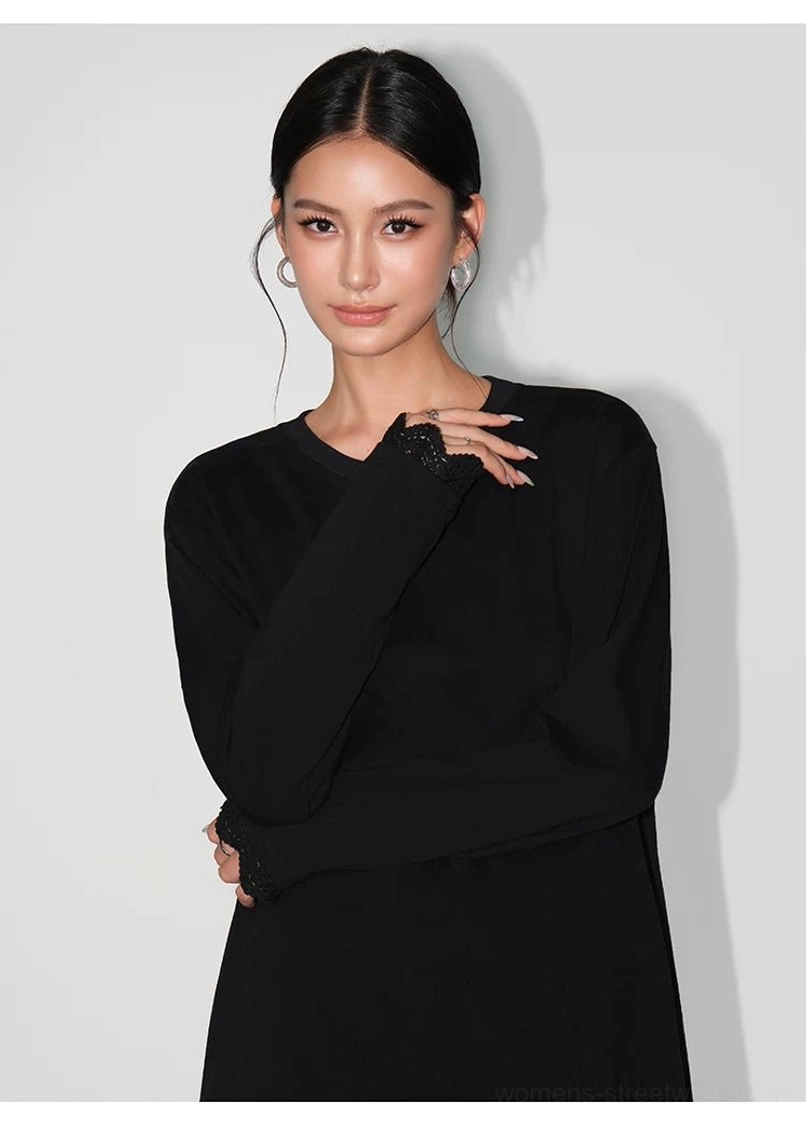 Oversized lace-hem long-sleeve tee dress in a minimalist streetwear style with relaxed fit and delicate scalloped trim