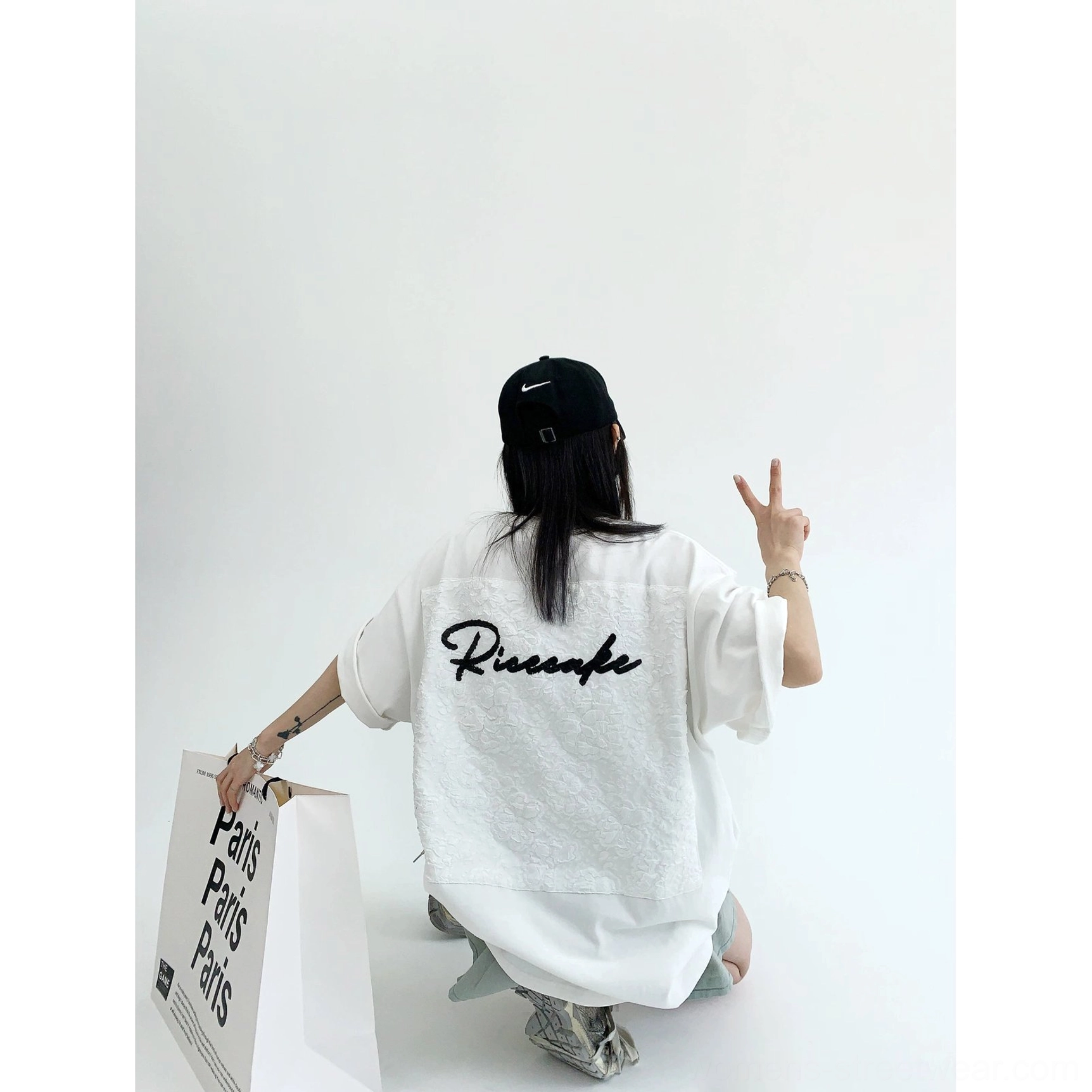 White oversized floral lace back panel T-shirt low angle rear view in Seoul inspired streetwear styling