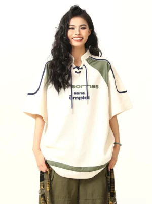 Apricot oversized lace-up collar American sports graphic T-shirt front view on female model