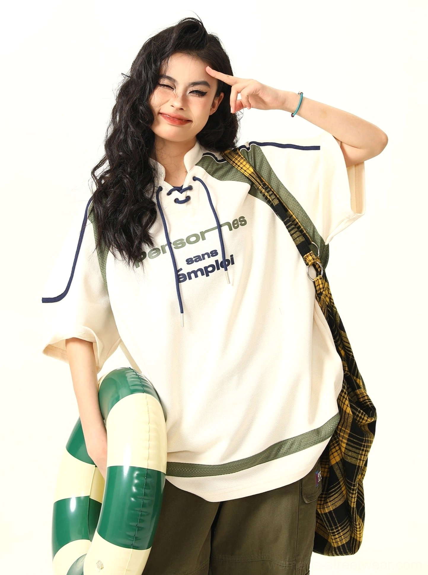 Apricot oversized varsity sports graphic T-shirt styled as Korean streetwear on female model
