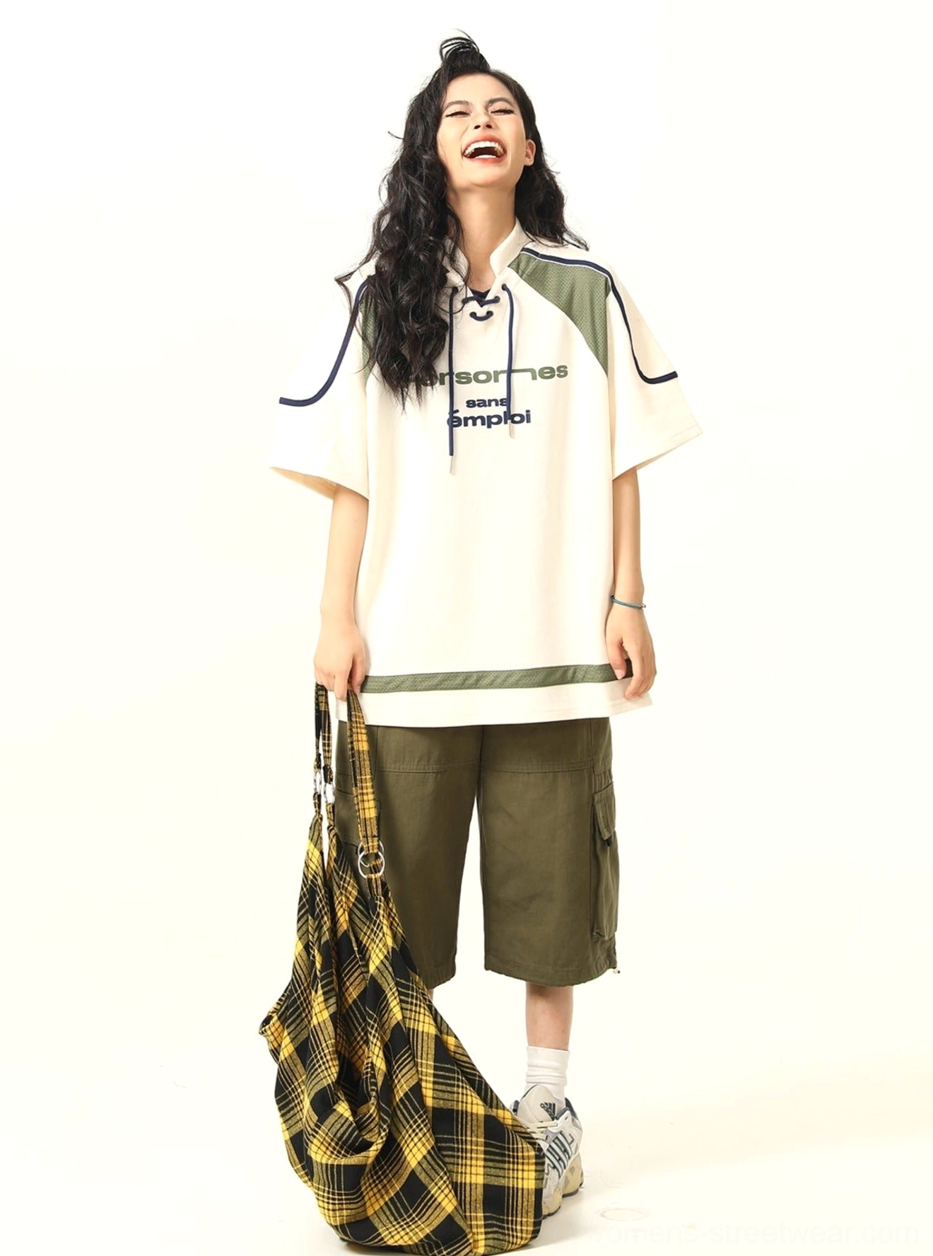 Oversized American sports graphic T-shirt paired with cargo shorts for a Korean streetwear outfit