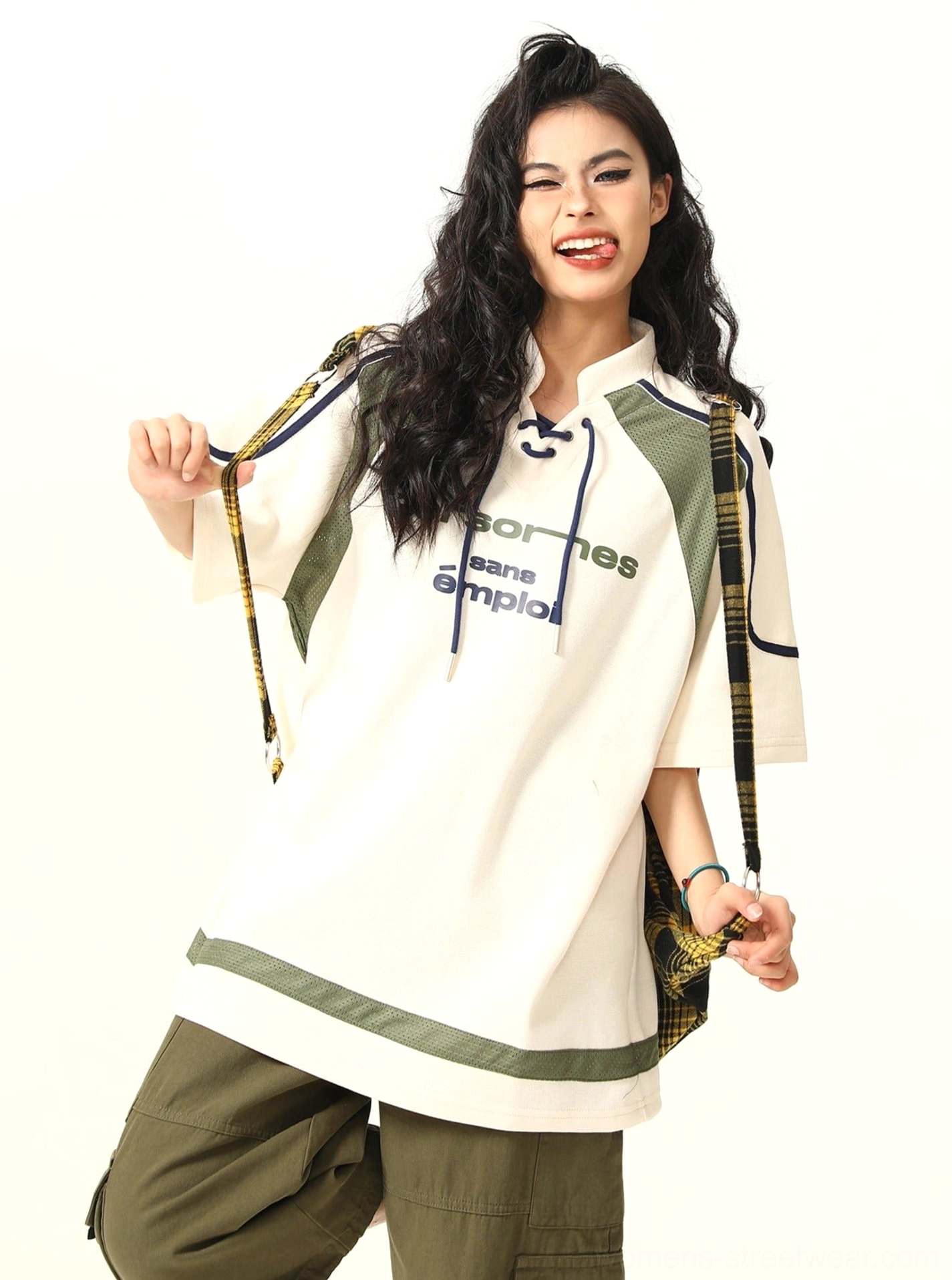 Side front view of oversized American sports T-shirt with lace-up stand collar and shoulder panels