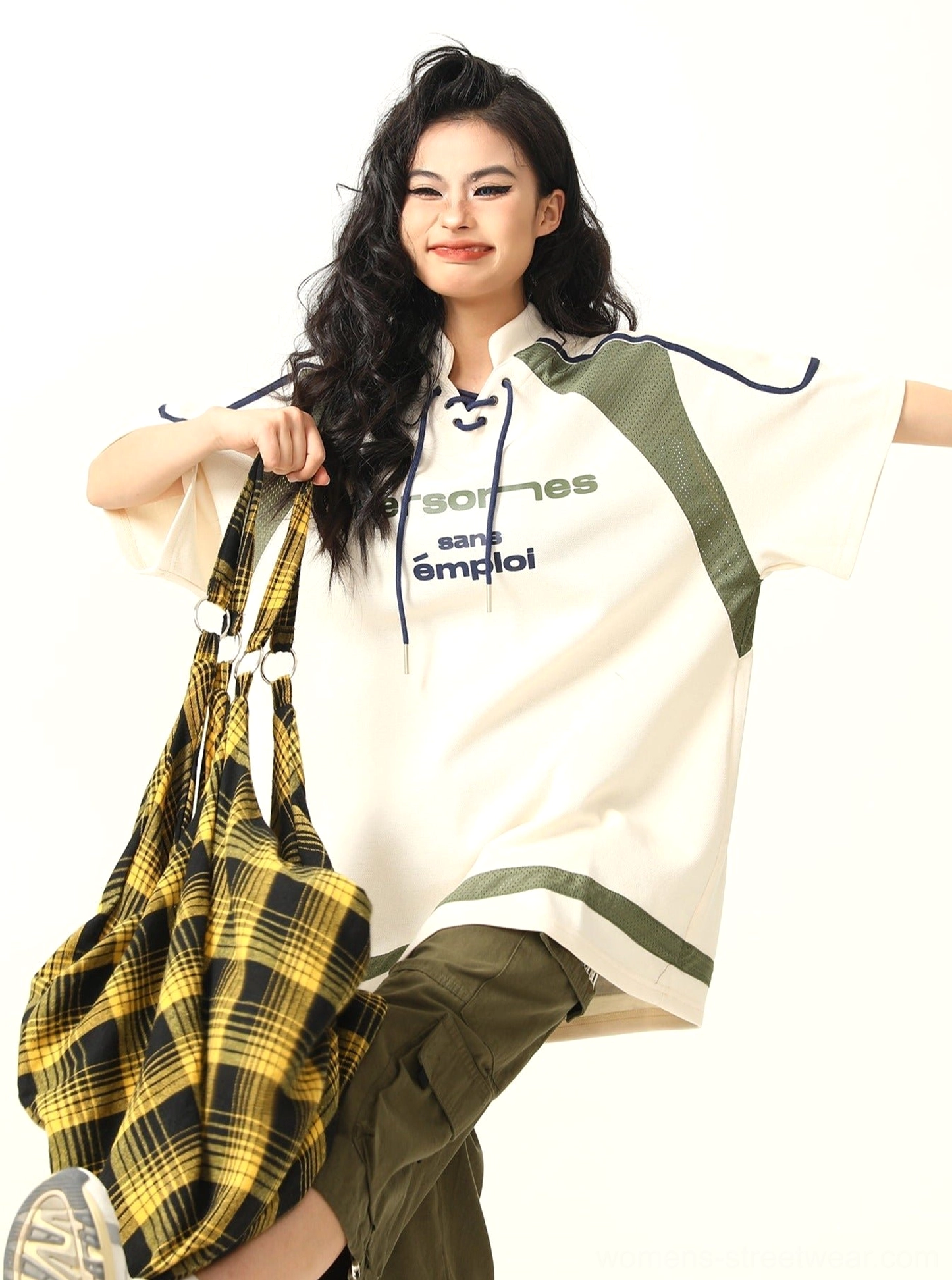 Low-angle view of oversized lace-up collar American sports graphic T-shirt with contrast trim