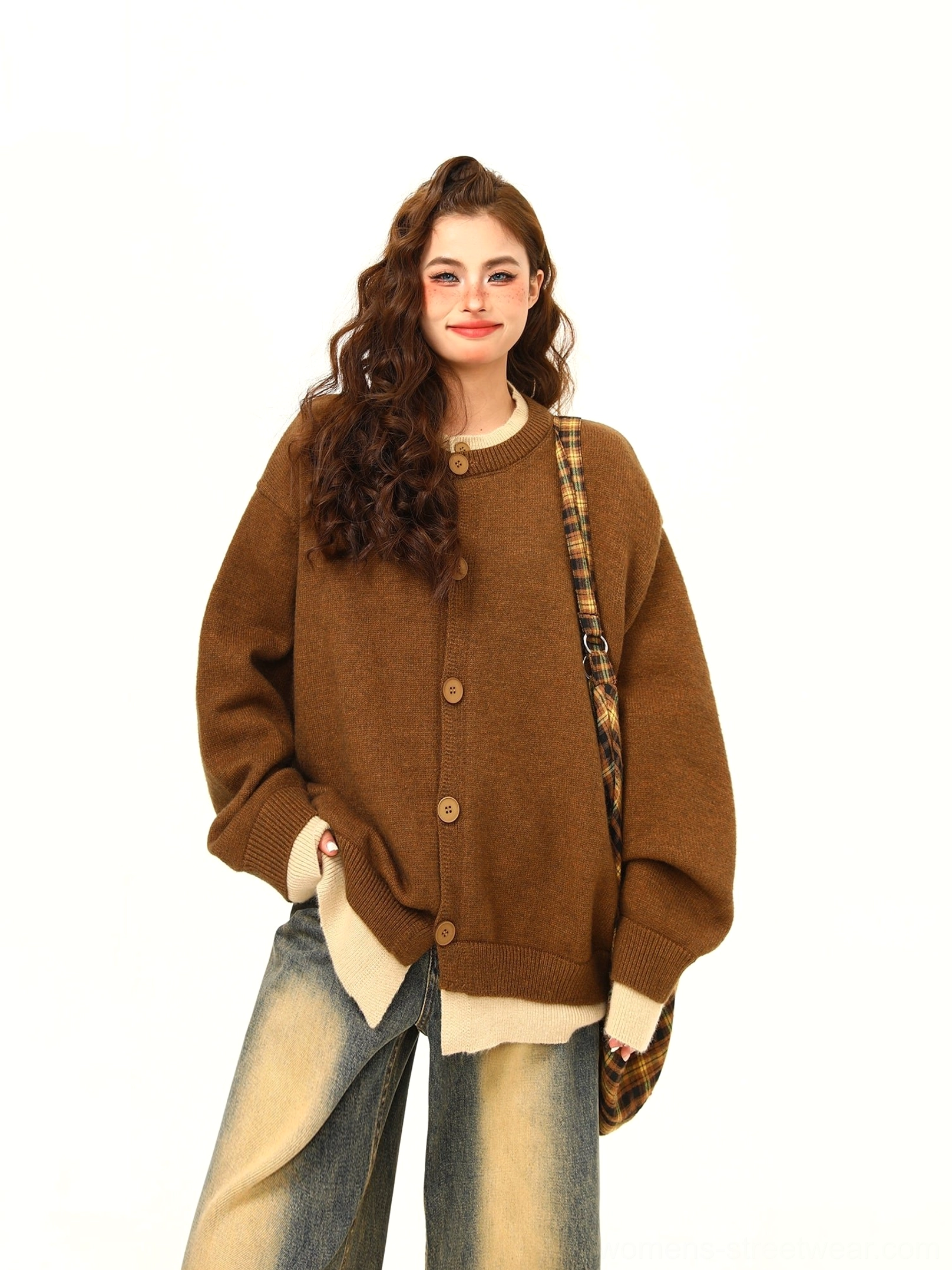 Dark brown oversized button knit cardigan with beige layered hem styled with yellow wash wide leg jeans