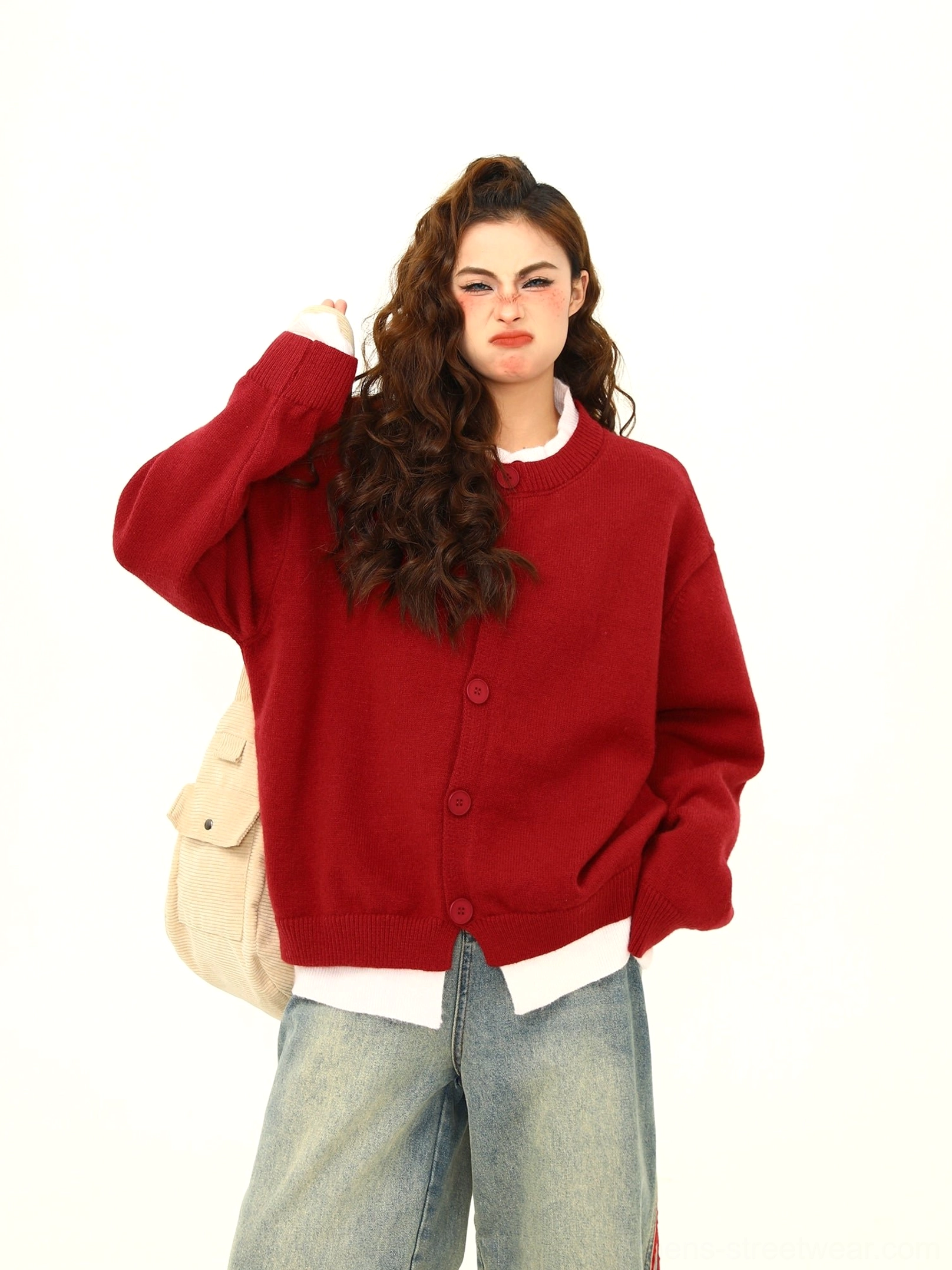 Bright red oversized layered hem button knit cardigan with white contrast underlayer and relaxed Korean streetwear styling