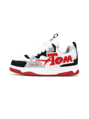 Red white and black oversized letter colorblock court sneakers side front view with layered synthetic leather panels