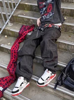 Model wearing red white and black oversized letter colorblock court sneakers with Y2K punk streetwear outfit on outdoor stairs