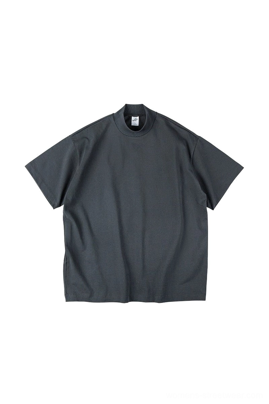 Dark charcoal oversized mock neck cotton streetwear t-shirt showing relaxed boxy fit and natural fabric texture