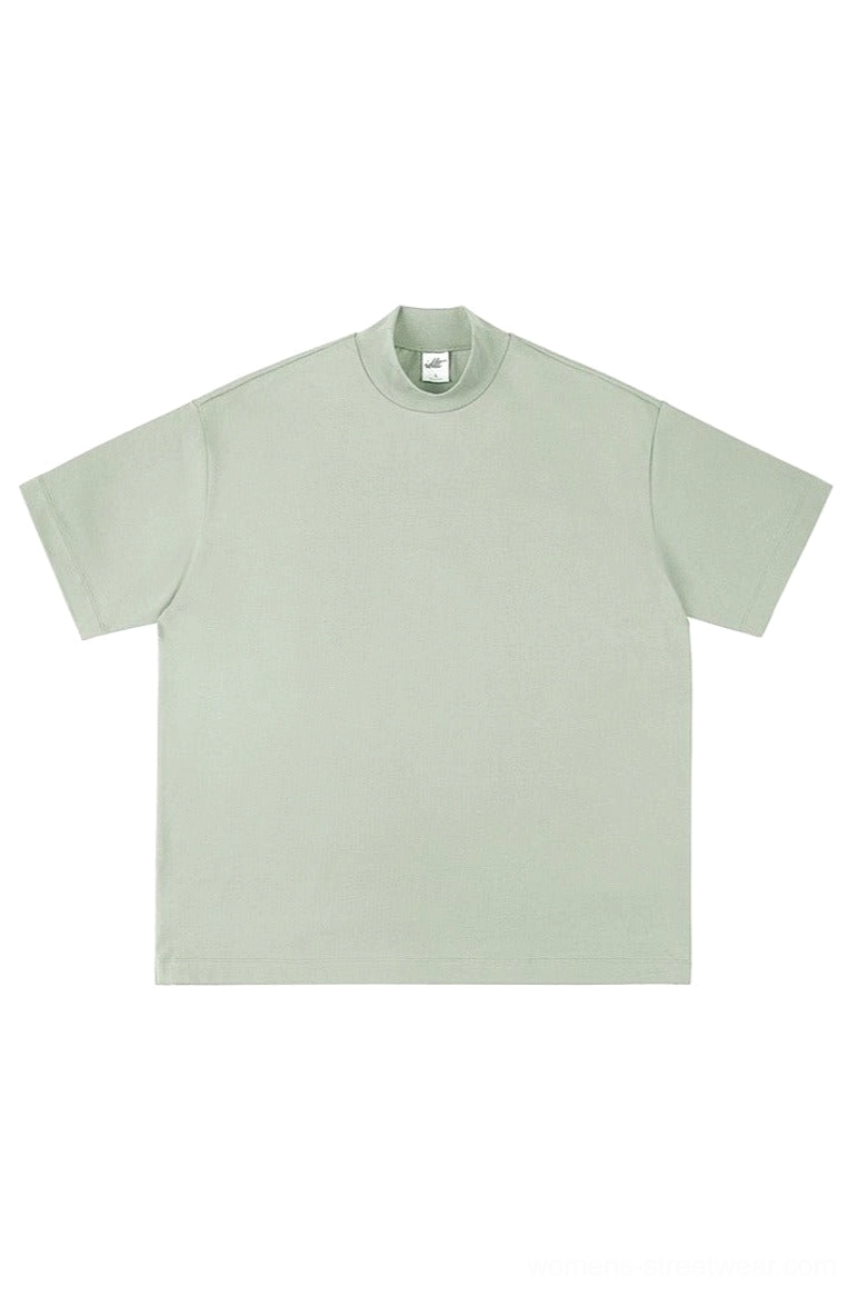 Sage light green oversized mock neck cotton t-shirt with dropped shoulders and relaxed boxy streetwear fit