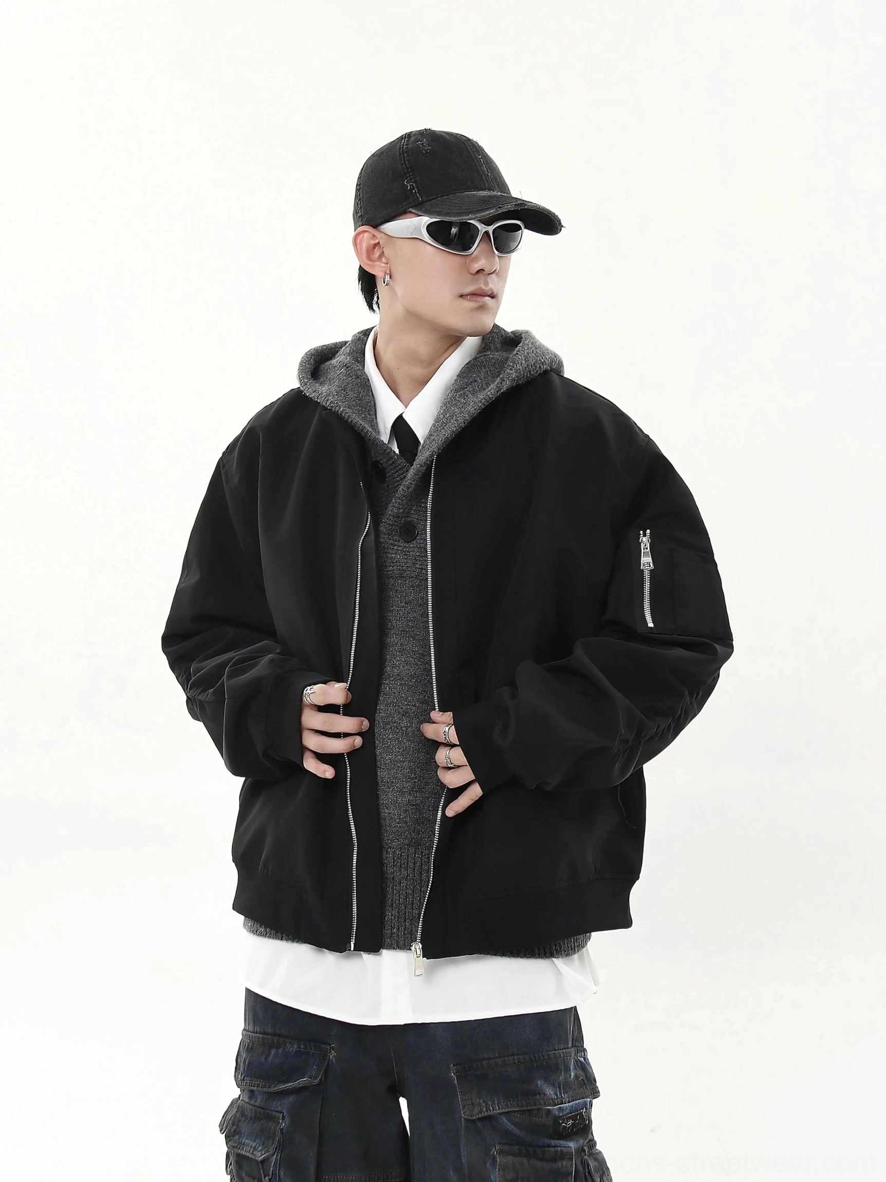 Black oversized modular flight bomber jacket with zip utility sleeve pocket and relaxed boxy fit