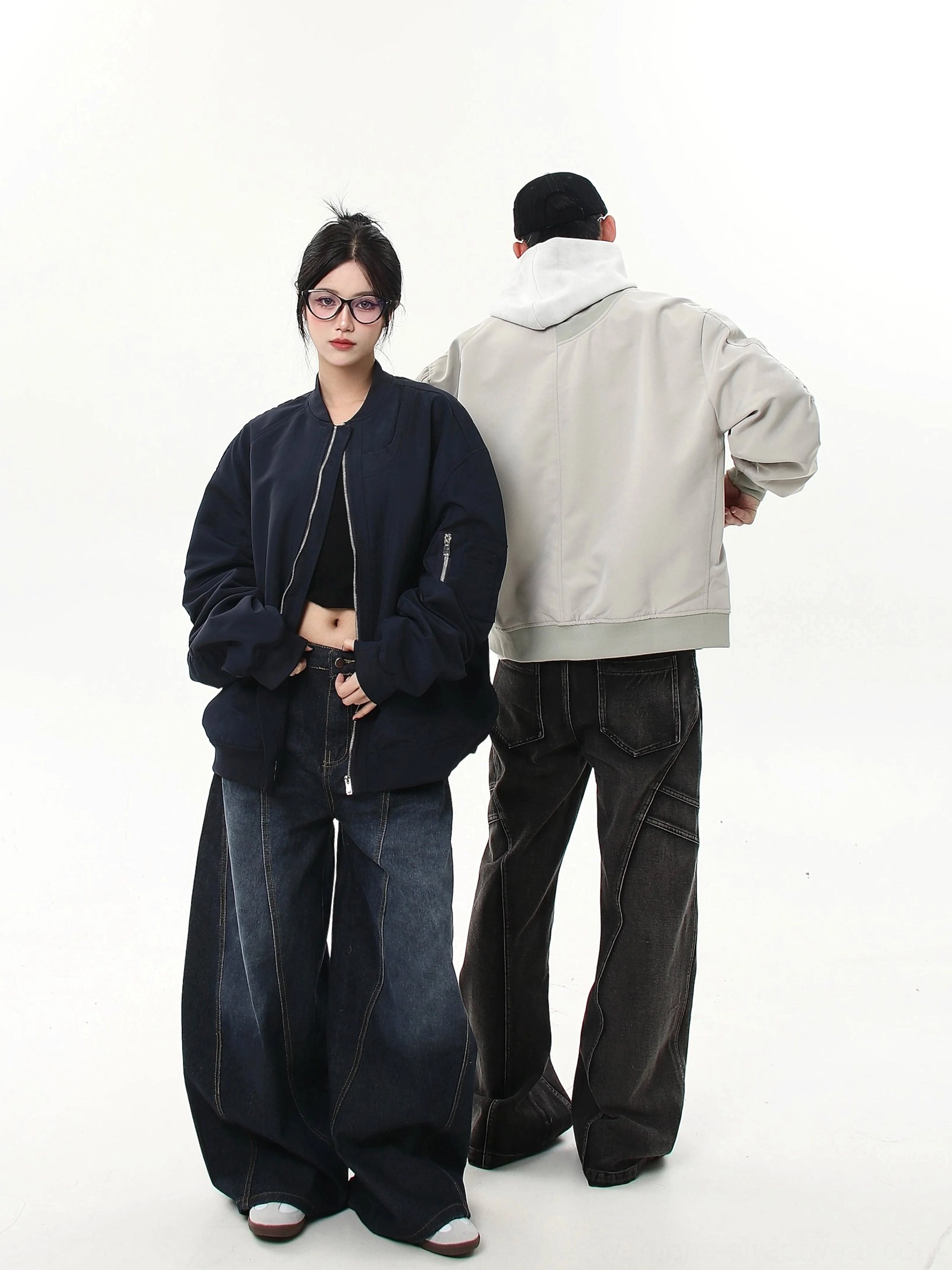 Oversized modular bomber jacket couple styling in gray and navy showing side and back streetwear silhouette