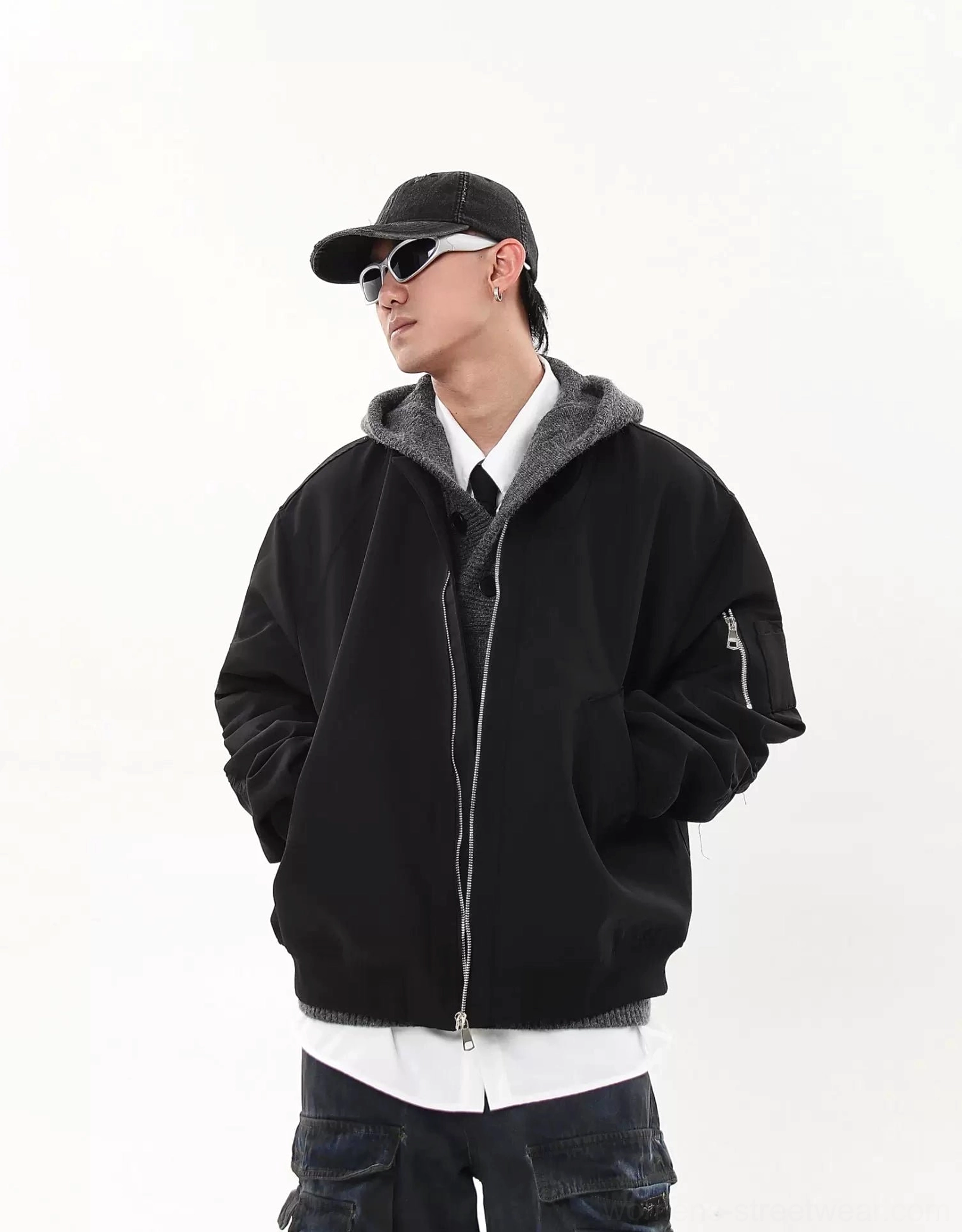 Oversized modular flight bomber jacket front zipper closure and welt pocket detail