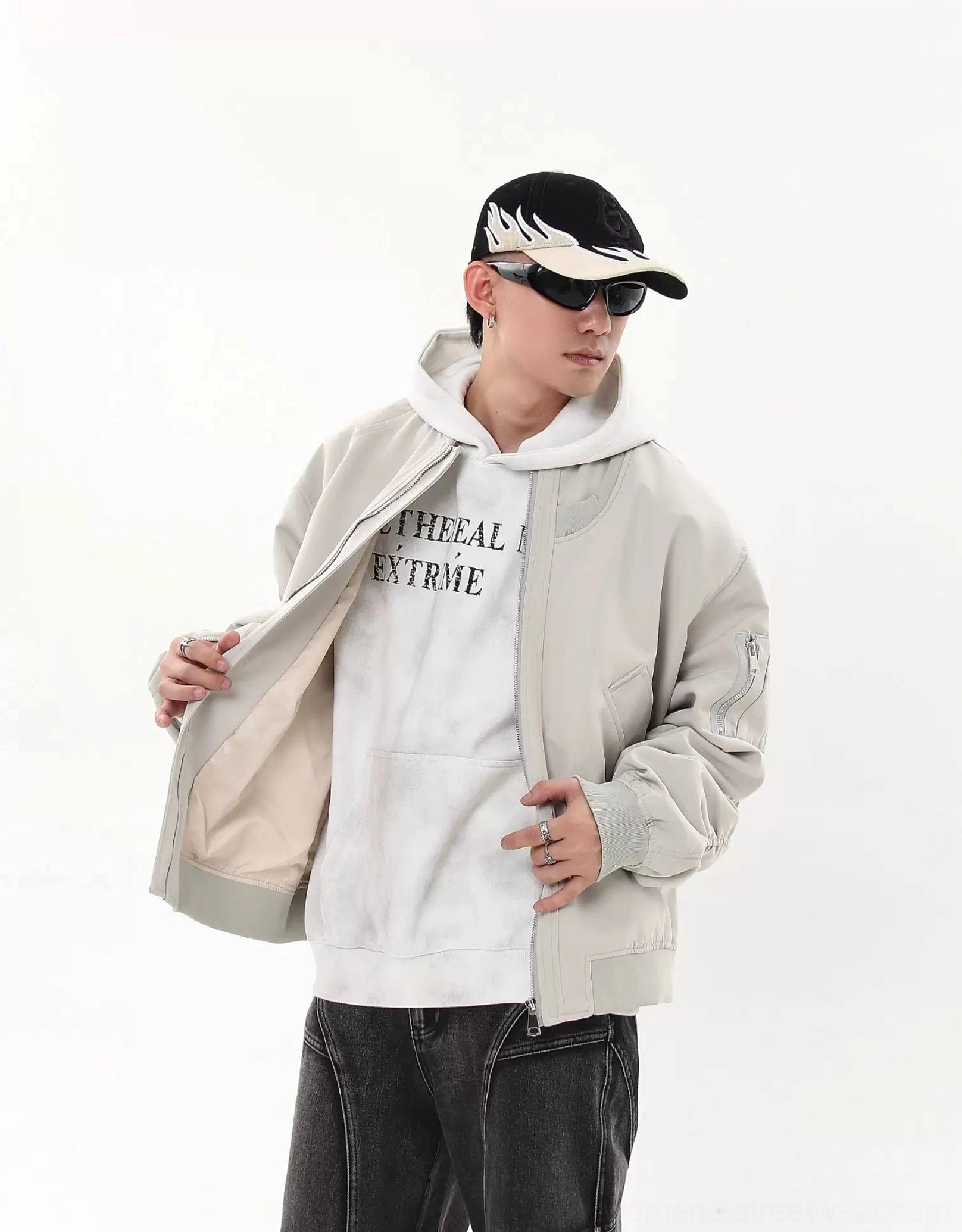 Light gray oversized flight bomber jacket worn open with layered casual streetwear outfit