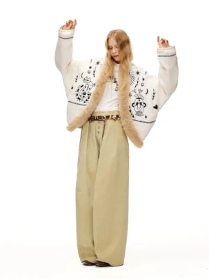 Oversized moonlight white fleece streetwear jacket with celestial embroidery and faux fur trim shown with raised arms