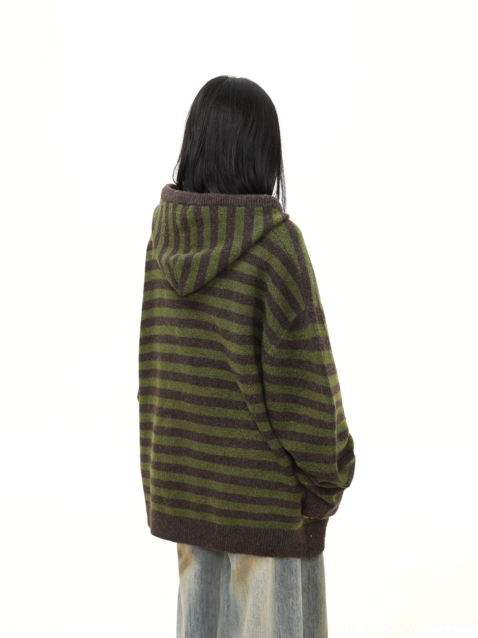 Rear view of an oversized moss green and charcoal striped knit hoodie cardigan with full-back stripe pattern and ribbed hem