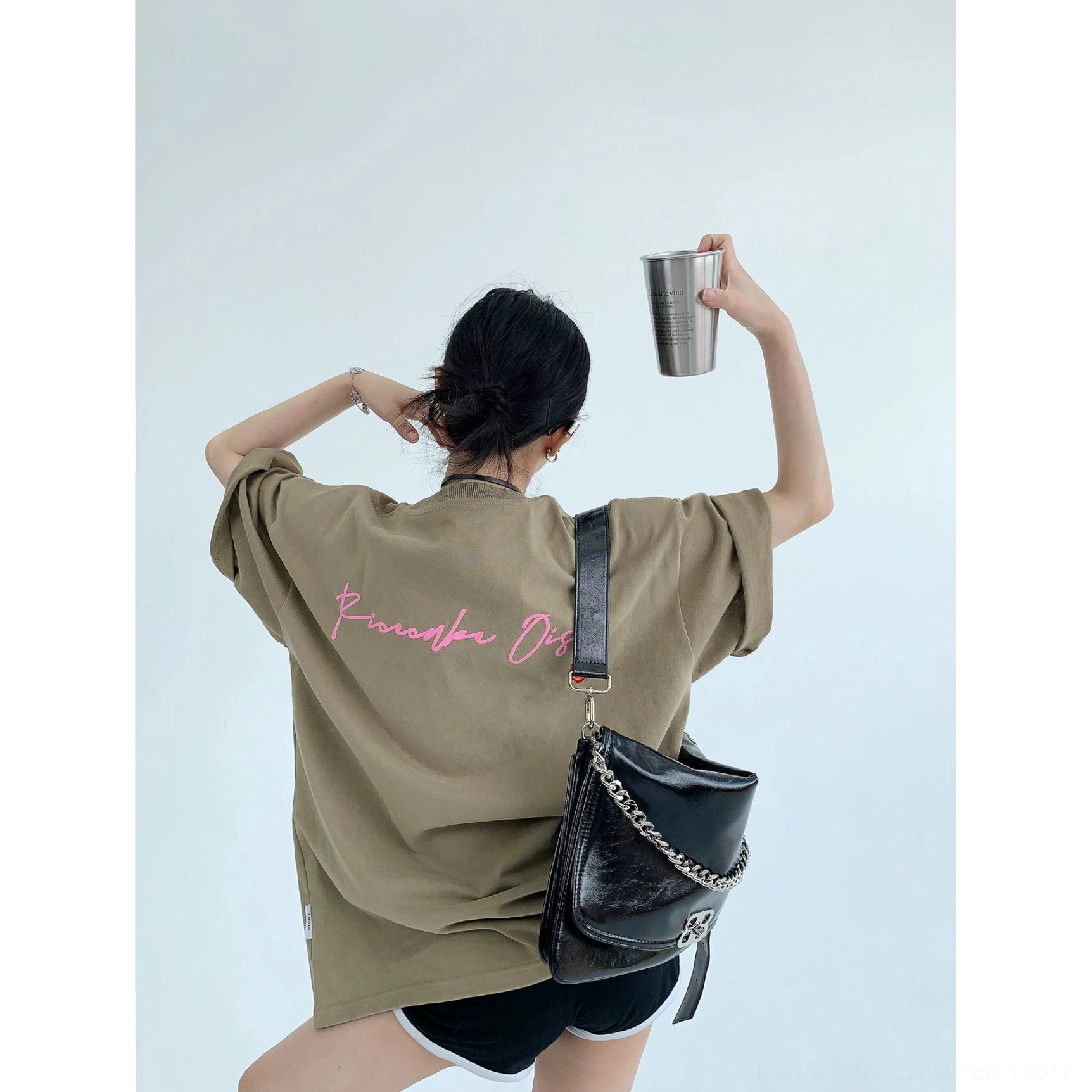 Oversized neon script back graphic cotton tee in relaxed streetwear styling with heavyweight fabric and bold pink lettering