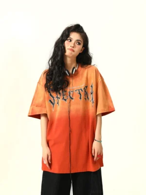 Front close view of orange gradient oversized graphic T-shirt with gothic Spectra lettering and dropped shoulders