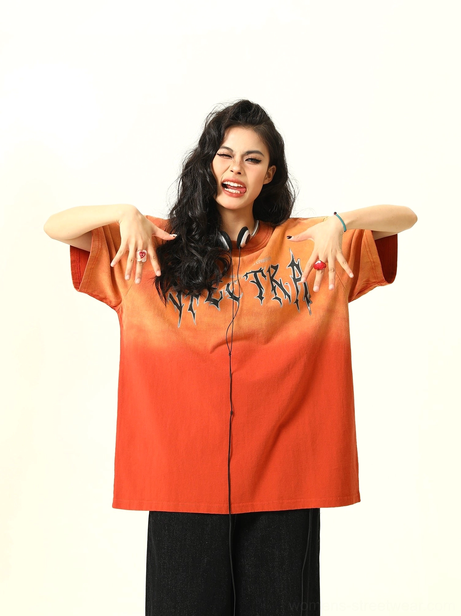Full body front view of loose orange gradient graphic T-shirt showing oversized silhouette and straight hem