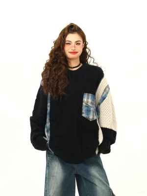 Black oversized patchwork cable knit plaid streetwear sweater styled with wide-leg blue jeans