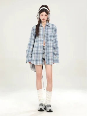 Blue plaid oversized boyfriend shirt styled with headphones and denim shorts in a Korean streetwear outfit